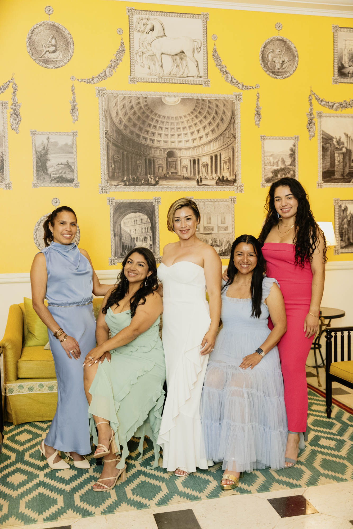 bride and female guests with colourful dresses