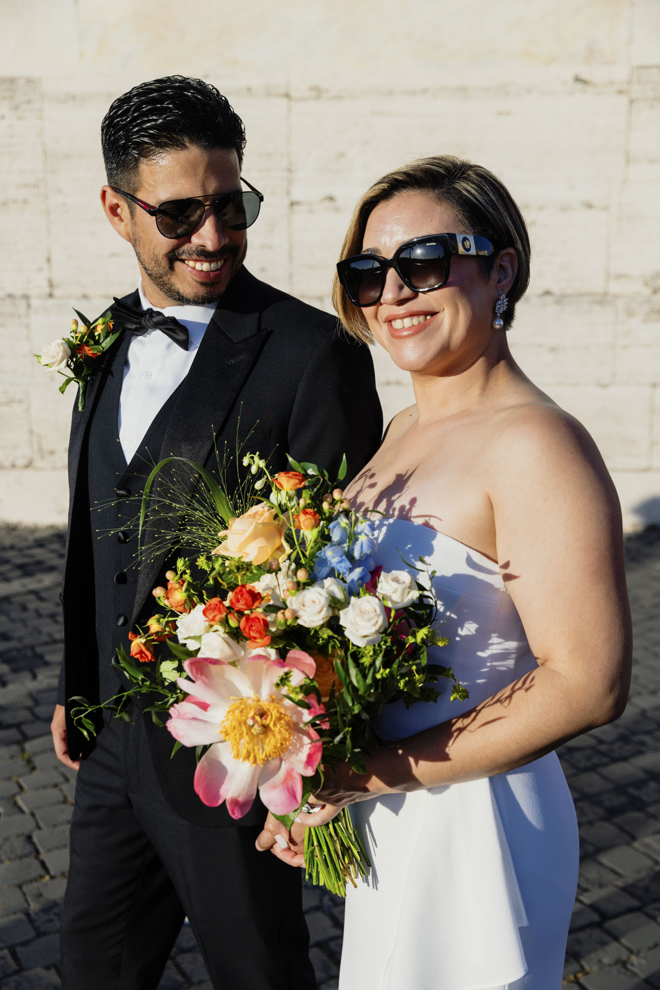 wedding couple with bridal bouquet walking around Rome