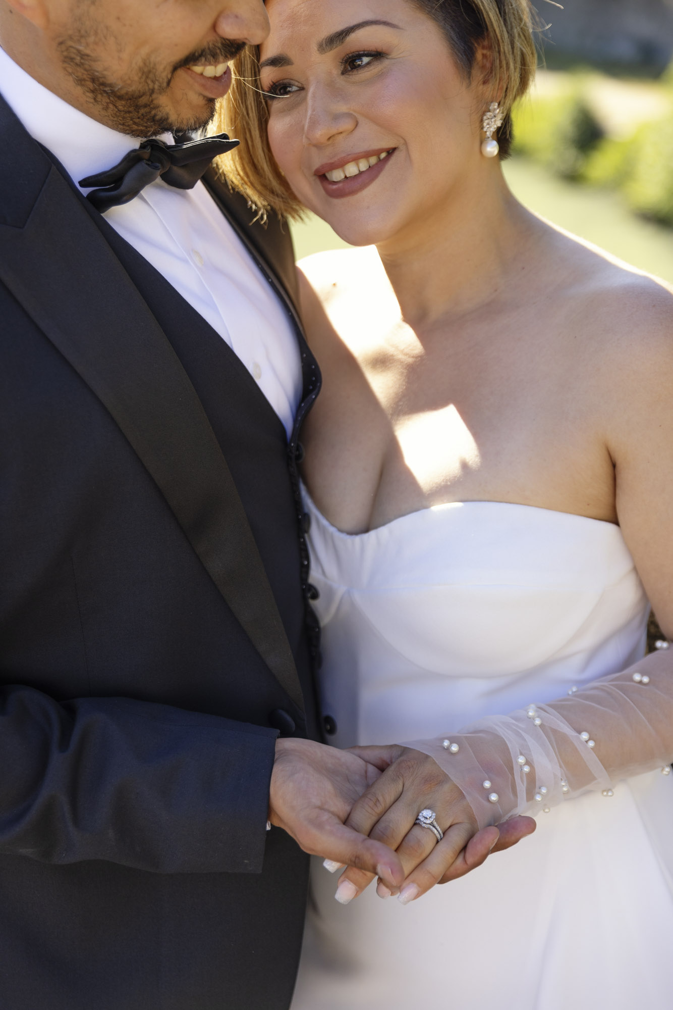 detail of couple and wedding ring