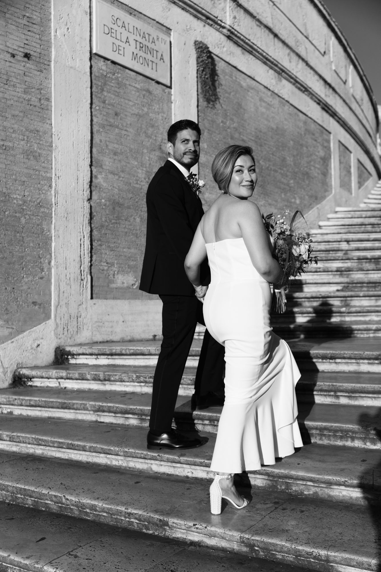 wedding couple walking up the Spanish Steps