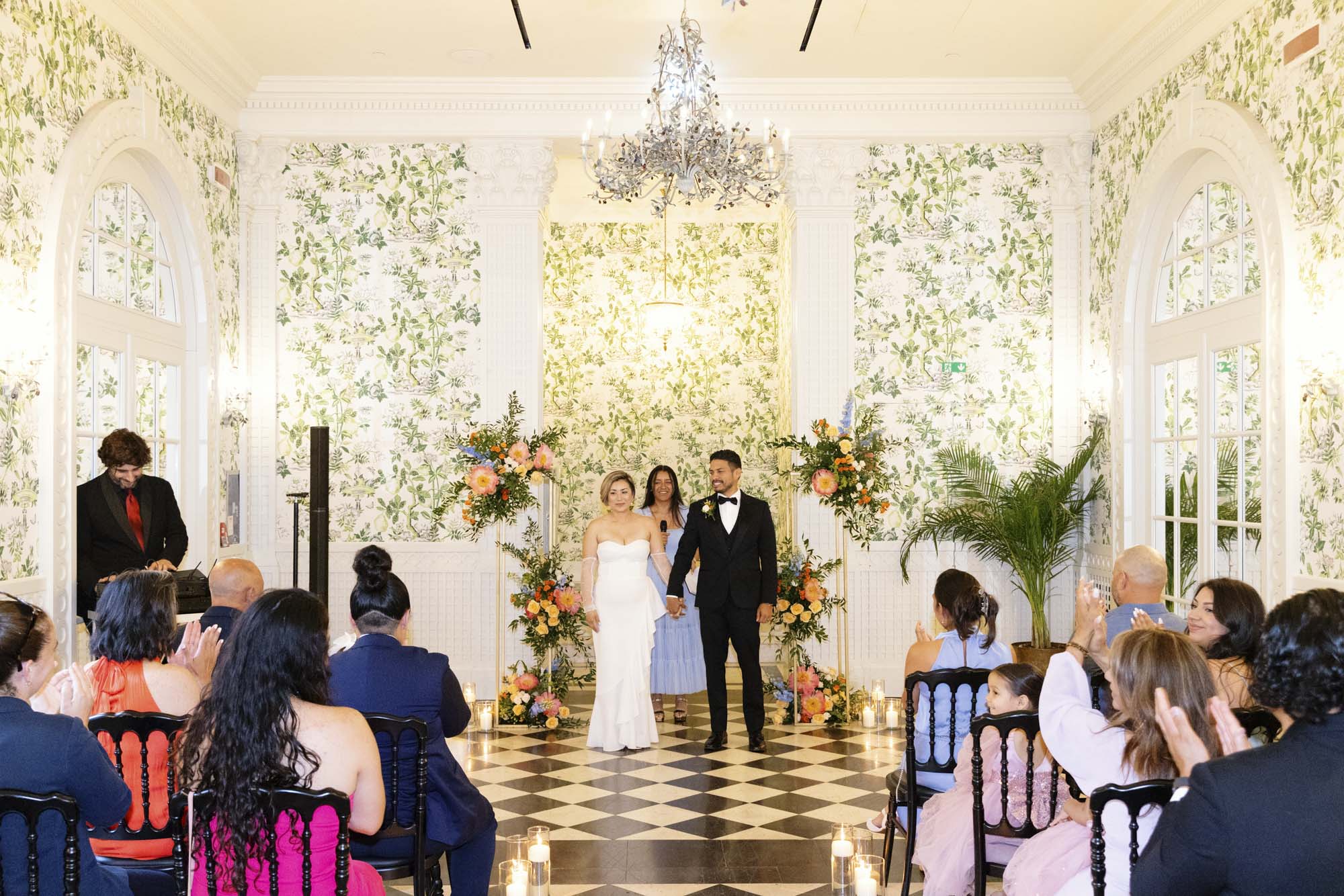 couple walking down the aisle at the end of vow renewal ceremony